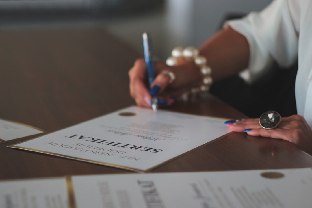 a-woman-writing-on-a-piece-of-paper-oe8q-mznut4